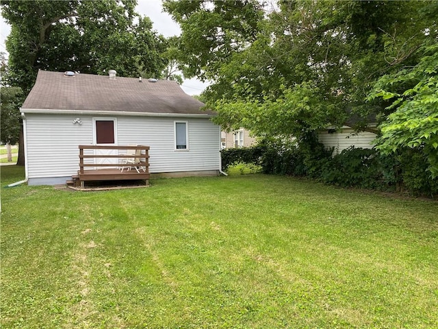 102 10th St, Charleston, IL 61920 - back of house featuring a wooden deck and a lawn