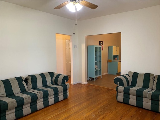 102 10th St, Charleston, IL 61920 - living room featuring wood finished floors and ceiling fan