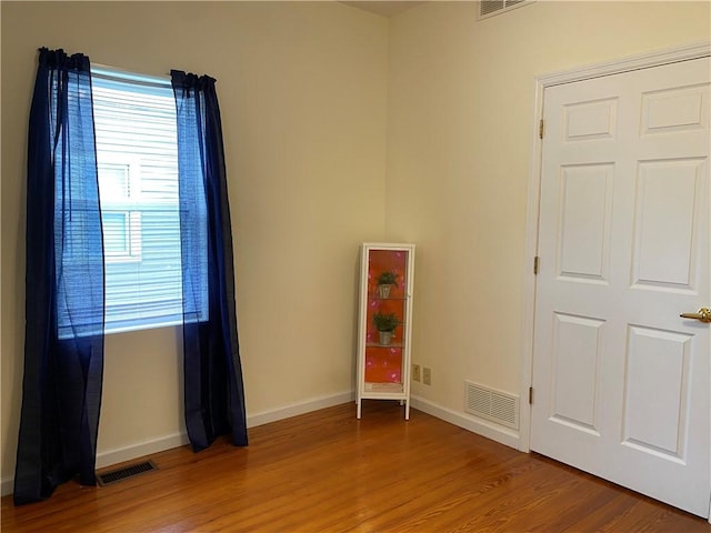 102 10th St, Charleston, IL 61920 - spare room with light wood finished floors and baseboards