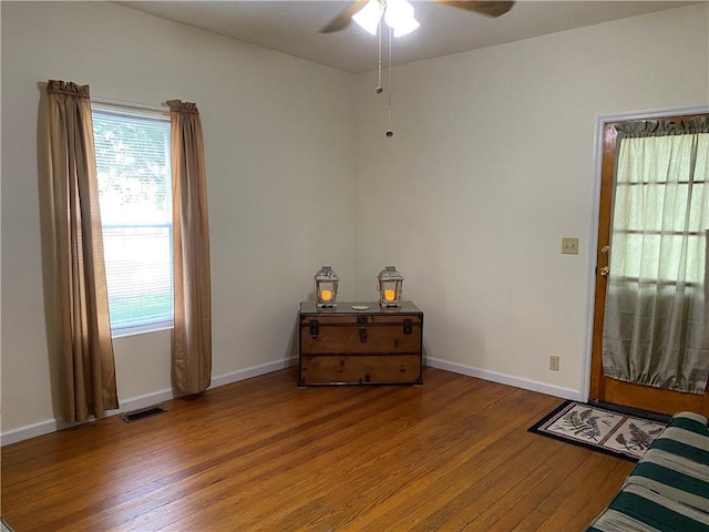 102 10th St, Charleston, IL 61920 - entryway with wood finished floors and a ceiling fan
