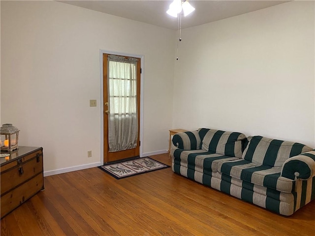 102 10th St, Charleston, IL 61920 - living room featuring wood finished floors and a ceiling fan