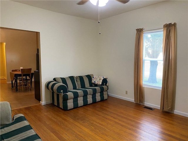 102 10th St, Charleston, IL 61920 - living room featuring light wood-style flooring and ceiling fan