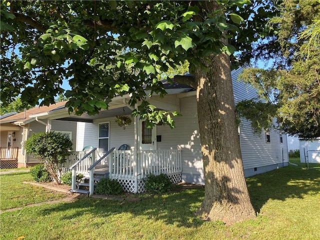 102 10th St, Charleston, IL 61920 - view of front of property featuring a porch, a front yard, and crawl space