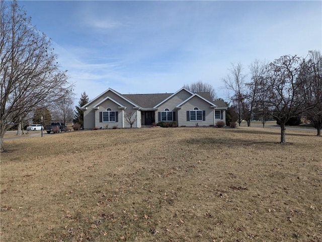 ranch-style home featuring a front yard