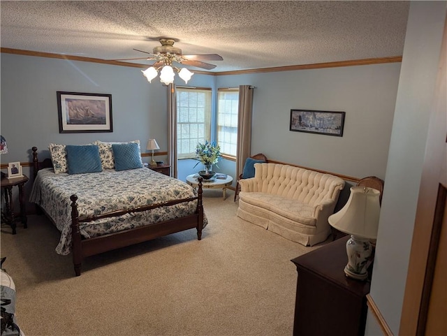 bedroom with a textured ceiling, crown molding, carpet, and a ceiling fan