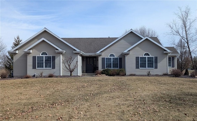 ranch-style house featuring a front yard