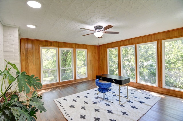 interior space featuring ceiling fan and dark wood-type flooring