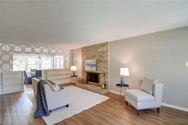 living room featuring hardwood / wood-style floors and a fireplace