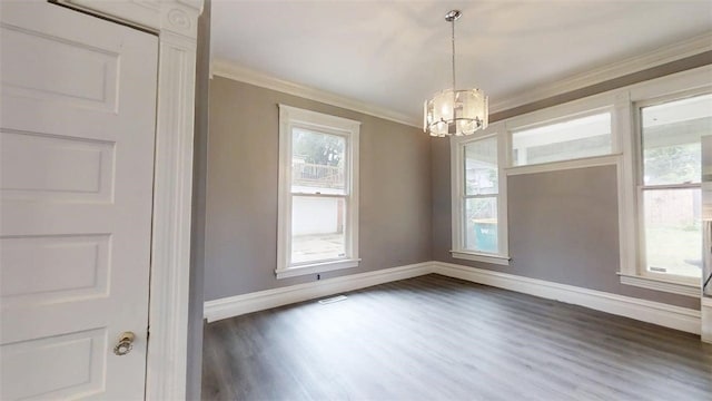 437 Powers Ln, Decatur, IL 62522 - empty room featuring a chandelier, dark wood-type flooring, and crown molding