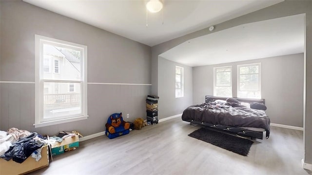 437 Powers Ln, Decatur, IL 62522 - bedroom featuring wood finished floors, lofted ceiling, and a ceiling fan