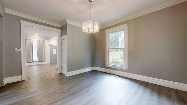 437 Powers Ln, Decatur, IL 62522 - unfurnished room featuring a chandelier, dark wood-style flooring, and crown molding