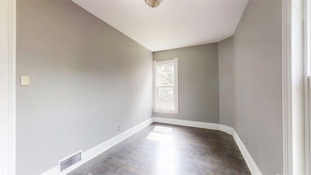 437 Powers Ln, Decatur, IL 62522 - unfurnished room featuring baseboards and wood finished floors