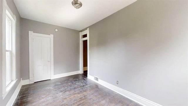 437 Powers Ln, Decatur, IL 62522 - empty room with wood finished floors and baseboards