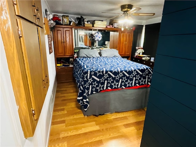 bedroom featuring ceiling fan and hardwood / wood-style flooring