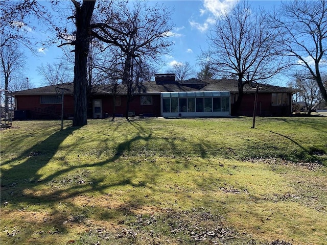 view of yard with a sunroom