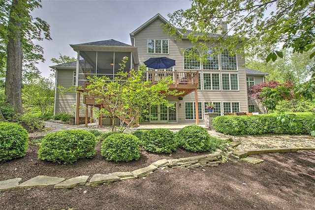 4140 S Lake Ct, Decatur, IL 62521 - back of property featuring a sunroom, a patio, a deck, and stairs