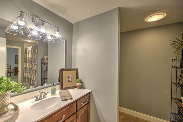 4140 S Lake Ct, Decatur, IL 62521 - bathroom with baseboards, tile patterned floors, and vanity