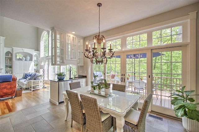 4140 S Lake Ct, Decatur, IL 62521 - dining area featuring visible vents, french doors, and a notable chandelier