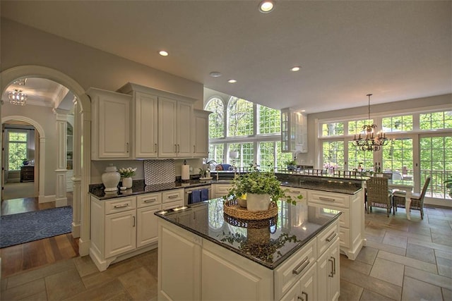 4140 S Lake Ct, Decatur, IL 62521 - kitchen featuring arched walkways, a center island, plenty of natural light, and recessed lighting