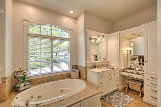4140 S Lake Ct, Decatur, IL 62521 - full bath with tile patterned floors, a tub with jets, plenty of natural light, and vanity