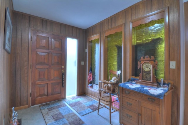 entrance foyer featuring wood walls