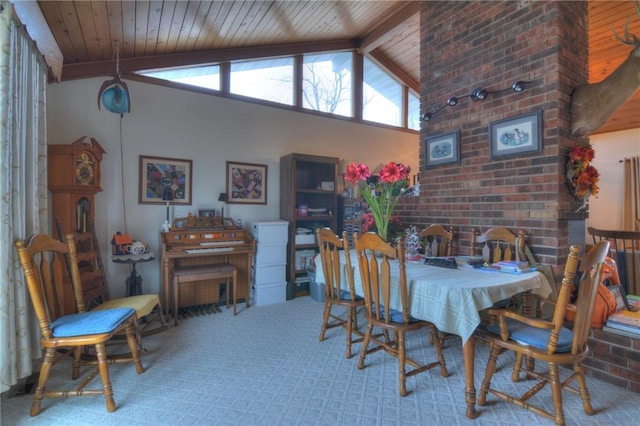 carpeted dining space featuring high vaulted ceiling, wood ceiling, and beam ceiling