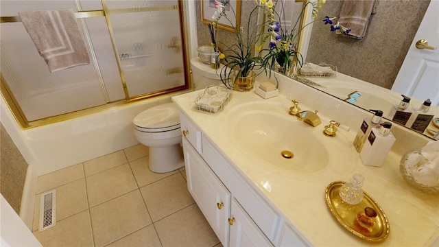 full bathroom featuring shower / bath combination with glass door, vanity, toilet, and tile patterned flooring