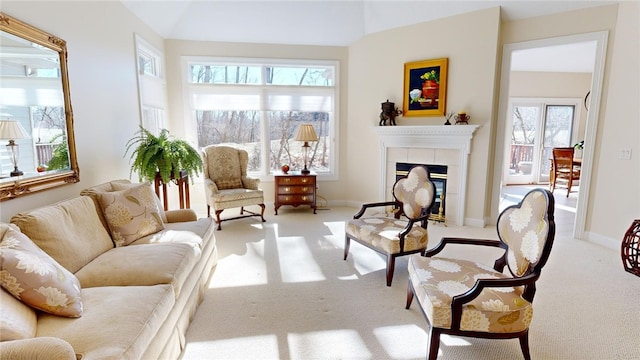 interior space with a fireplace, plenty of natural light, and light colored carpet