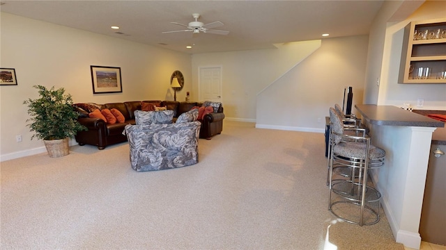 living room with bar and ceiling fan