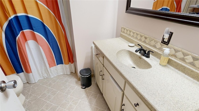 bathroom with tile patterned floors and vanity