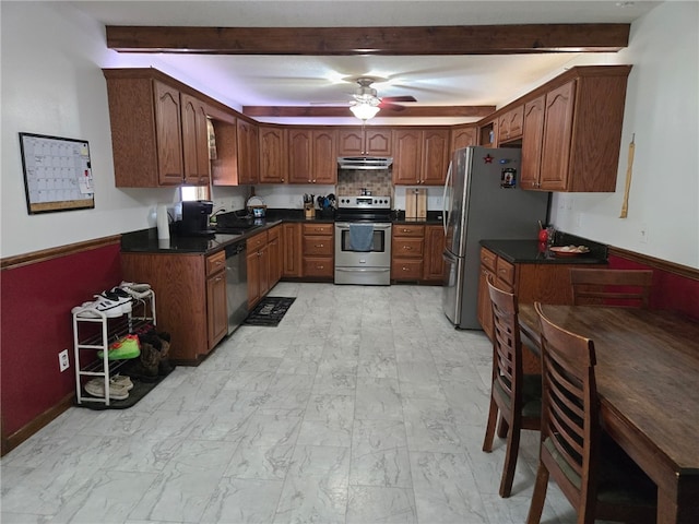 208 Roosevelt St, Paris, IL 61944 - kitchen featuring appliances with stainless steel finishes, under cabinet range hood, beamed ceiling, dark countertops, and a ceiling fan
