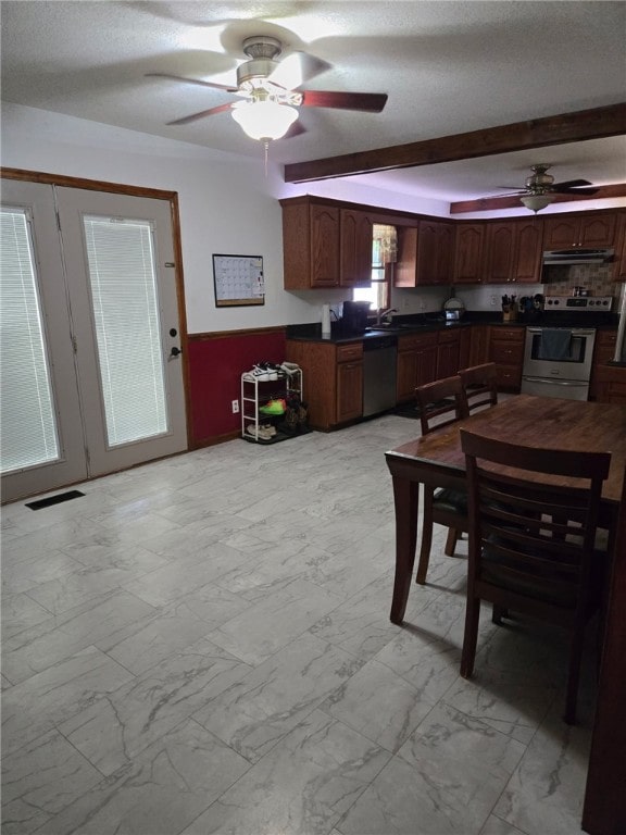208 Roosevelt St, Paris, IL 61944 - dining area with a ceiling fan, light marble finish flooring, and a textured ceiling