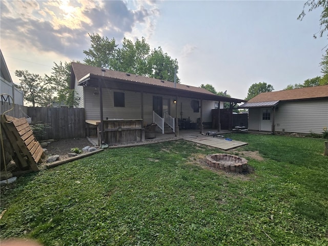 208 Roosevelt St, Paris, IL 61944 - back of house with an outdoor fire pit, a patio area, and entry steps