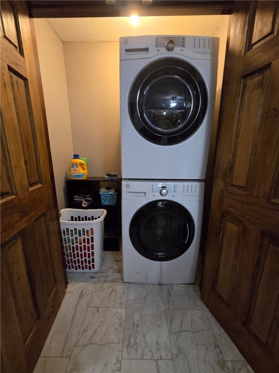 208 Roosevelt St, Paris, IL 61944 - laundry area featuring stacked washer / dryer and light marble finish floors
