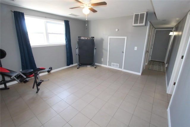 workout area with a ceiling fan, visible vents, and baseboards