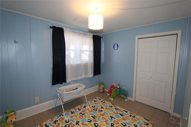 rec room with tile patterned flooring and baseboards