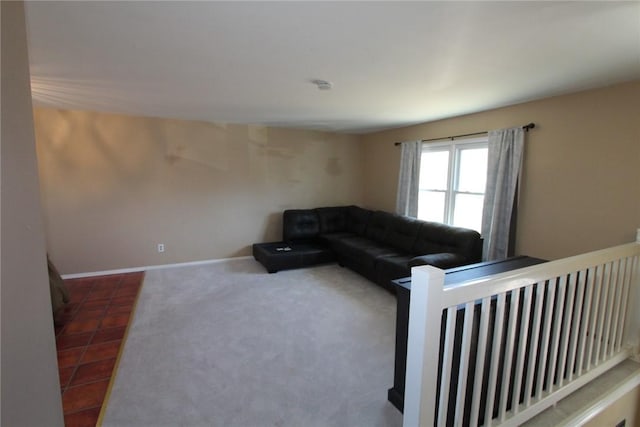 carpeted living room featuring baseboards