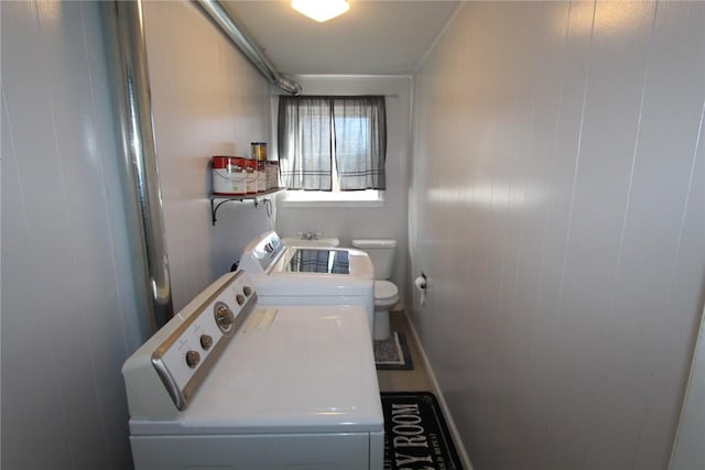 washroom featuring laundry area and washer and clothes dryer