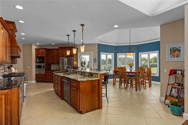 11107 E Cambridge Ln, Effingham, IL 62401 - kitchen featuring appliances with stainless steel finishes, a kitchen breakfast bar, recessed lighting, a warming drawer, and a kitchen island with sink