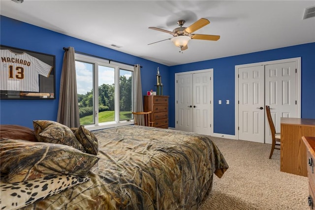 11107 E Cambridge Ln, Effingham, IL 62401 - bedroom featuring carpet flooring, multiple closets, and a ceiling fan