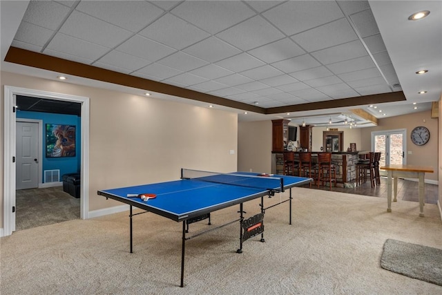 11107 E Cambridge Ln, Effingham, IL 62401 - recreation room featuring a drop ceiling, light carpet, bar, and a tray ceiling