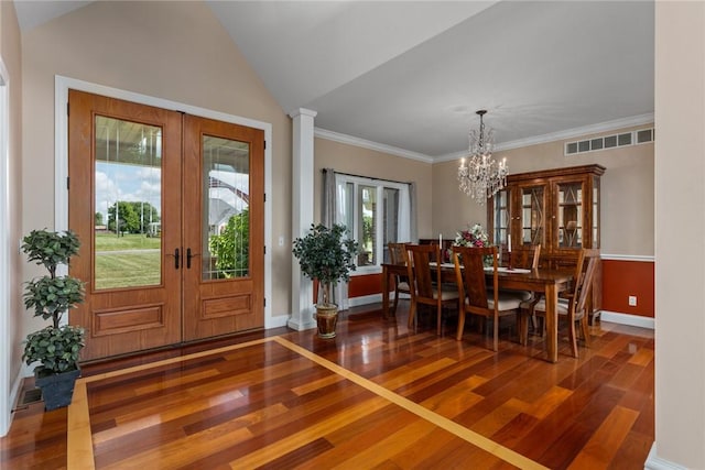 11107 E Cambridge Ln, Effingham, IL 62401 - dining space featuring french doors, wood-type flooring, a chandelier, and vaulted ceiling