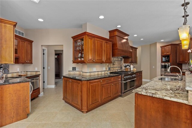 11107 E Cambridge Ln, Effingham, IL 62401 - kitchen featuring stainless steel appliances, premium range hood, glass insert cabinets, dark stone counters, and recessed lighting