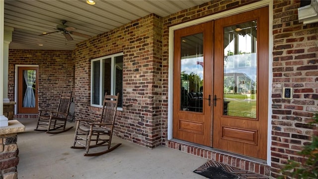11107 E Cambridge Ln, Effingham, IL 62401 - property entrance with french doors, brick siding, and a ceiling fan