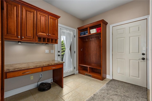 11107 E Cambridge Ln, Effingham, IL 62401 - mudroom with built in desk and light tile patterned floors