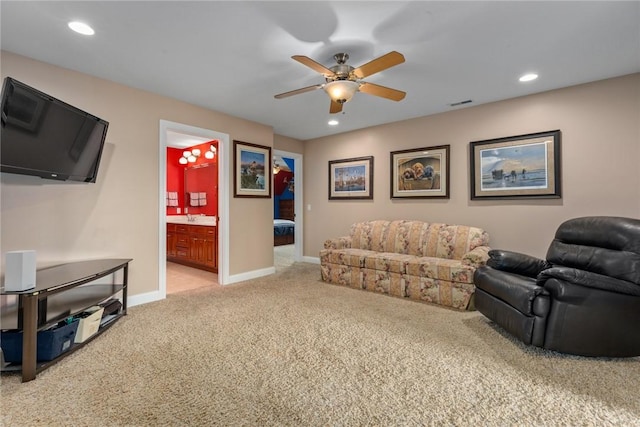11107 E Cambridge Ln, Effingham, IL 62401 - living area with light carpet, a ceiling fan, and recessed lighting