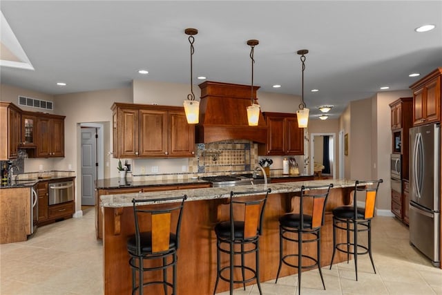 11107 E Cambridge Ln, Effingham, IL 62401 - kitchen with appliances with stainless steel finishes, a warming drawer, custom exhaust hood, tasteful backsplash, and recessed lighting