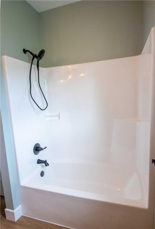 3812 Sonny Ln, Danville, IL 61832 - full bath with wood finished floors and tub / shower combination