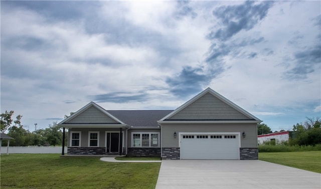 craftsman house featuring a front yard and a garage