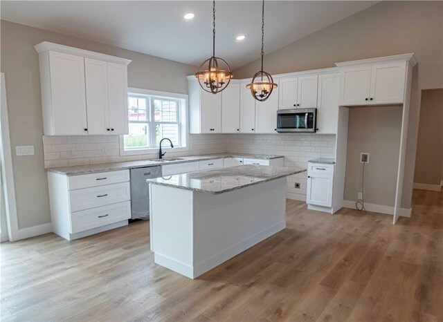 3812 Sonny Ln, Danville, IL 61832 - kitchen with stainless steel appliances, a sink, a chandelier, backsplash, and recessed lighting